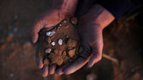 Grain farmer Ty Fulwood holds re-engineered sandy soil at his farm in Grass Valley, Australia, May ... Grain farmer Ty Fulwood holds re-engineered sandy soil at his farm in Grass Valley, Australia, May ...