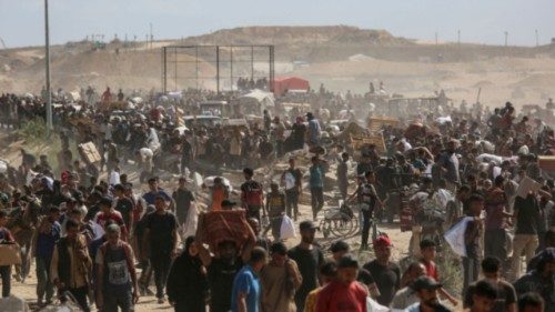 Palestinians carry aid supplies which they received from the U.S.-backed Gaza Humanitarian ... Palestinians carry aid supplies which they received from the U.S.-backed Gaza Humanitarian ...
