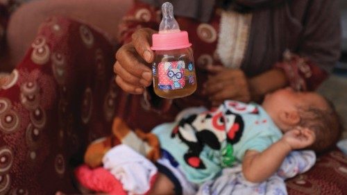 Nemah Hamouda holds a baby bottle while cradling her three-month-old granddaughter, Muntaha, in her ... Nemah Hamouda holds a baby bottle while cradling her three-month-old granddaughter, Muntaha, in her ...