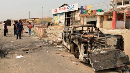 Residents walk past a looted supermarket in the Kalemba 2 district of Luanda on July 29, 2025 during ... Residents walk past a looted supermarket in the Kalemba 2 district of Luanda on July 29, 2025 during ...