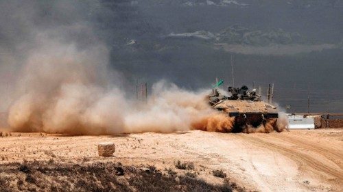 An Israeli army infantry-fighting vehicle (IFV) leaves a cloud of dust as it moves at a position ... An Israeli army infantry-fighting vehicle (IFV) leaves a cloud of dust as it moves at a position ...