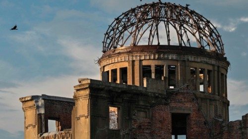 Crows fly around the top of the Atomic Bomb Dome on the eve of the 80th anniversary of the world's ...