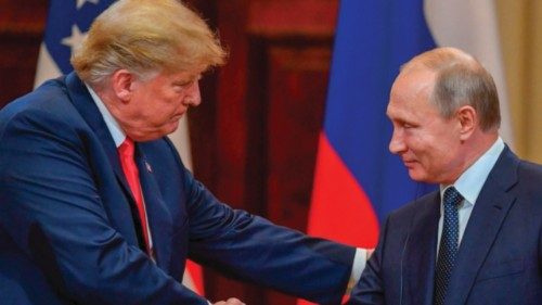 (FILES) US President Donald Trump (L) and Russia's President Vladimir Putin shake hands before ... (FILES) US President Donald Trump (L) and Russia's President Vladimir Putin shake hands before ...