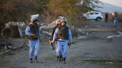 Azerbaijani service members walk during mine lifting in Agdam town in the region of Karabakh, ... Azerbaijani service members walk during mine lifting in Agdam town in the region of Karabakh, ...