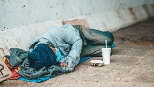 The beggars lay on their side of the street with dirty clothes. The beggars lay on their side of the street with dirty clothes.