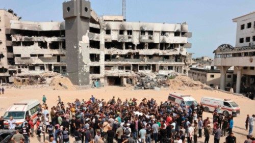 TOPSHOT - Mourners carry bodies of Palestinians, including journalists and a medic, killed in an ... TOPSHOT - Mourners carry bodies of Palestinians, including journalists and a medic, killed in an ...
