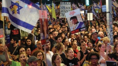 People attend a demonstration organised by families and friends of Israelis held hostage by ...