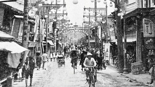 Photograph of the downtown shopping district near the center of town, facing east. Only rubble and a ...
