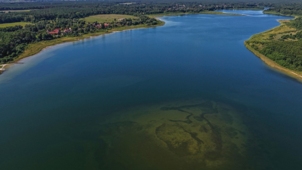 epa12308215 An aerial view taken with a drone shows the Seddin lake in the south of Berlin, Seddin, ...