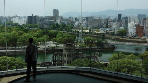 A man looks at the preserved Atomic Bomb Dome from an observation point near the Hiroshima Peace ... A man looks at the preserved Atomic Bomb Dome from an observation point near the Hiroshima Peace ...