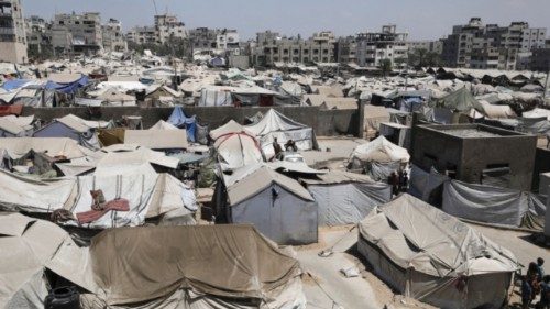 Palestinians displaced by the Israeli military offensive take shelter in tents, in Gaza City, August ... Palestinians displaced by the Israeli military offensive take shelter in tents, in Gaza City, August ...