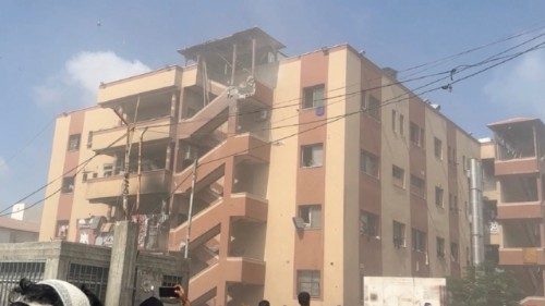 People walk at the site of Israeli strikes on Nasser hospital where Palestinian cameraman Hussam ... People walk at the site of Israeli strikes on Nasser hospital where Palestinian cameraman Hussam ...