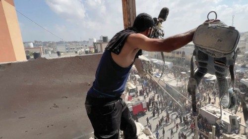 A man reacts as he holds the equipment used by Palestinian cameraman Hussam al-Masri, who was a ... A man reacts as he holds the equipment used by Palestinian cameraman Hussam al-Masri, who was a ...