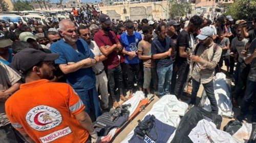 epa12321406 People pray in front of the bodies of Palestinians killed in an Israeli airstrike at ... epa12321406 People pray in front of the bodies of Palestinians killed in an Israeli airstrike at ...