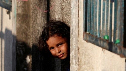 A Palestinian child displaced by the Israeli military offensive looks on from a shelter at an UNRWA ... A Palestinian child displaced by the Israeli military offensive looks on from a shelter at an UNRWA ...