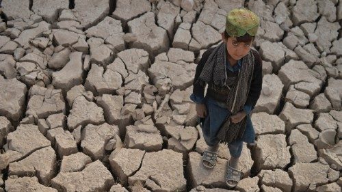 This picture taken on October 15, 2021 shows a child standing on a dry land in Bala Murghab district ... This picture taken on October 15, 2021 shows a child standing on a dry land in Bala Murghab district ...