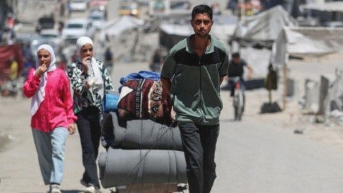 A displaced Palestinian pulls belongings behind him, as he flees amid an Israeli military operation, ... A displaced Palestinian pulls belongings behind him, as he flees amid an Israeli military operation, ...