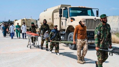 Afghan medical and Taliban security personnel carry stretchers for evacuated earthquake victims upon ... Afghan medical and Taliban security personnel carry stretchers for evacuated earthquake victims upon ...