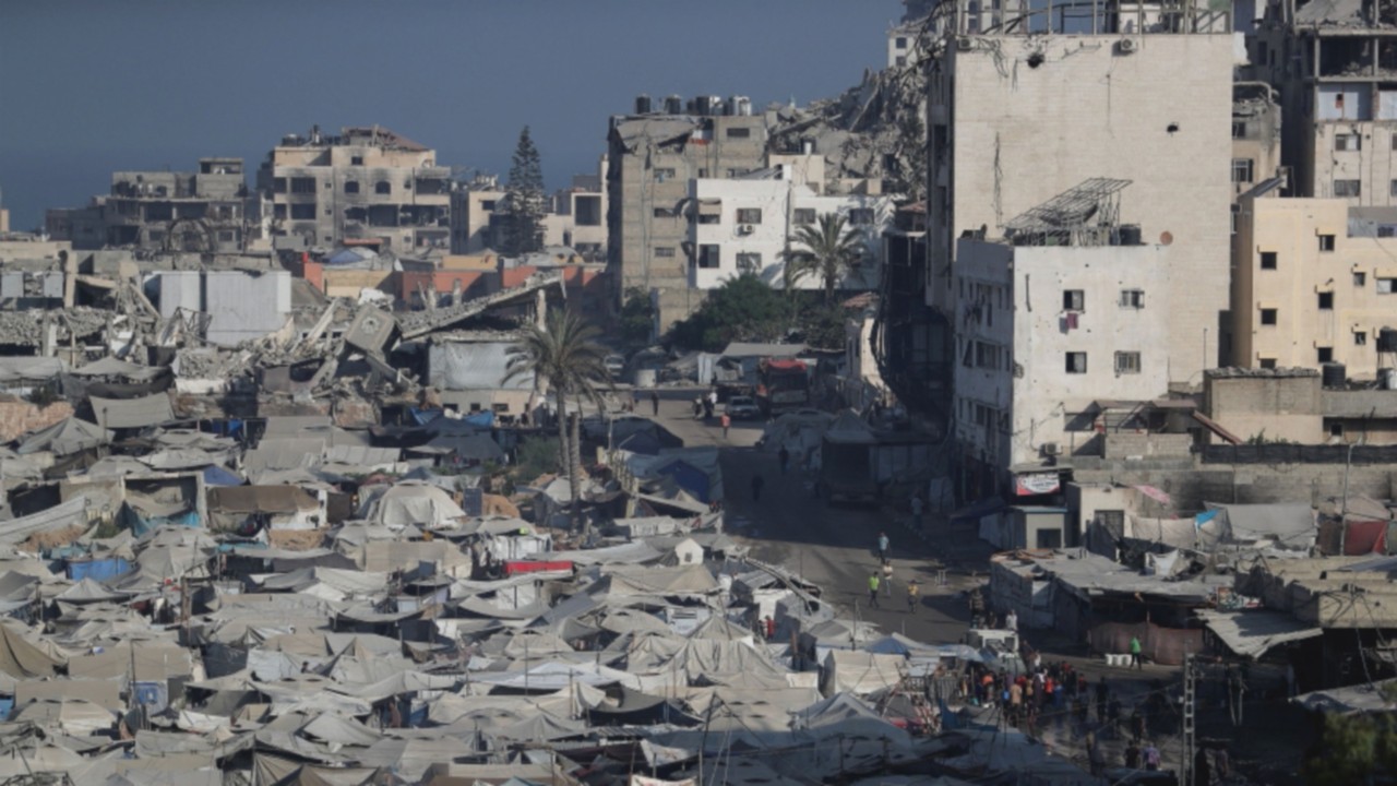 Palestinians displaced by the Israeli military offensive take shelter in a tent camp, as Israeli ...