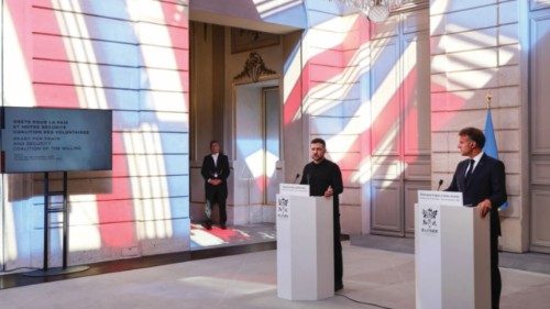 Ukraine's President Volodymyr Zelensky speaks next to France's President Emmanuel Macron during a ... Ukraine's President Volodymyr Zelensky speaks next to France's President Emmanuel Macron during a ...