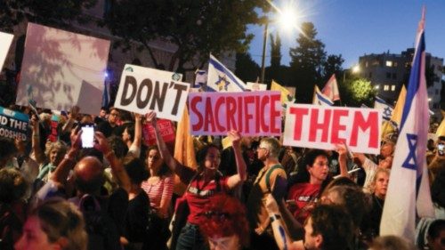 People attend a protest demanding the immediate release of the hostages kidnapped during the deadly ... People attend a protest demanding the immediate release of the hostages kidnapped during the deadly ...