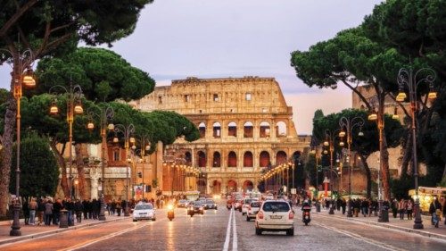 Rome, Italy - April 04: Traffic on the Via dei Fori Imperiali street in front of Colosseum in the ... Rome, Italy - April 04: Traffic on the Via dei Fori Imperiali street in front of Colosseum in the ...