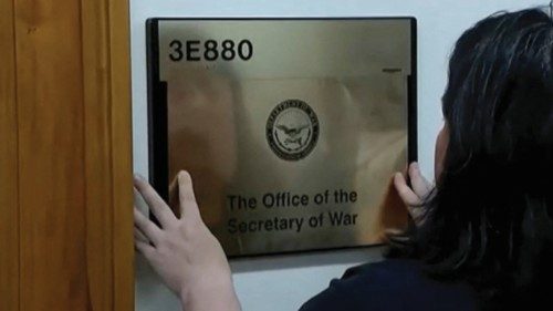 A worker places a plaque that reads 'The Office of the Secretary of War' after U.S. President Donald ... A worker places a plaque that reads 'The Office of the Secretary of War' after U.S. President Donald ...
