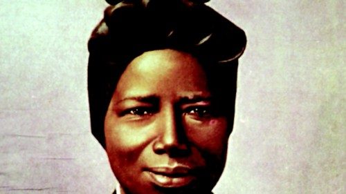 A tapestry portrait of St. Josephine Bakhita, an African slave who died in 1947, hangs from the ...