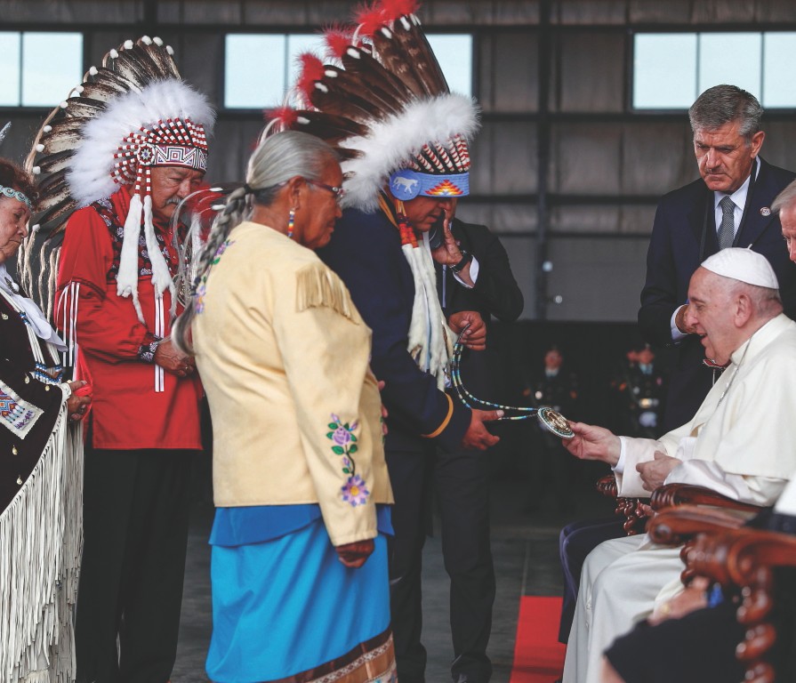 Pope Francis is welcomed after arriving at Edmonton International Airport, near Edmonton, Alberta, ...