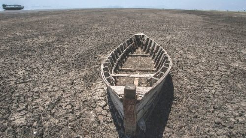 A wooden boat lies on the dry lake bottom at the dried inland Lake Chilwa's vacated Kachulu Harbour ...