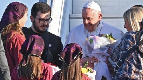 Pope Francis is welcomed upon his arrival in the southern Cypriot port city of Larnaca on December ...