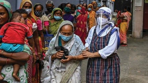 Nuns from Missionaries of Charity distribute food to the needy on the occasion of ?Peace Day? to ...