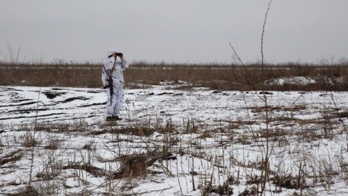 A service member of the Ukrainian armed forces is seen at the line of separation from Russian-backed ...