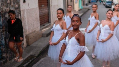 Students of the Ballet Manguinhos School practice dance movements during a photo session at the ...