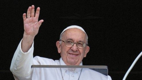 Pope Francis waves as he leads the Angelus prayer from his window, at the Vatican August 7, 2022. ...