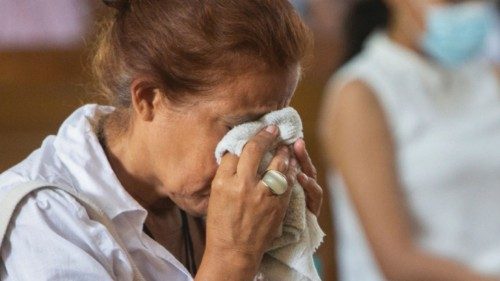 A parishioner reacts during a mass at Metropolitan Cathedral in Managua, Nicaragua August 21, 2022. ...