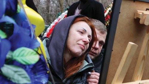 epa10411321 Relatives and friends react during a funeral ceremony for Mykhailo Korenovsky, a boxing ...
