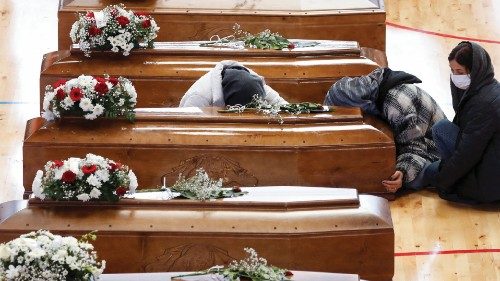 Mourners react near coffins of victims who died in a migrant shipwreck, in Crotone, Italy March 1, ...