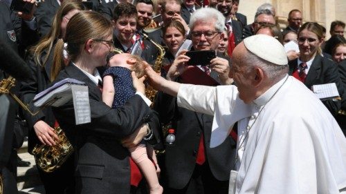 Pope Francis greets a child as he attends the weekly general audience in St. Peter's Square at the ... Pope Francis greets a child as he attends the weekly general audience in St. Peter's Square at the ...
