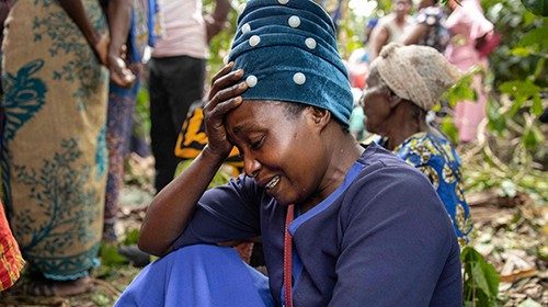 A woman mourns during the funeral of Florence Masika and Zakayo Masereka in Mpondwe on June 18, ...