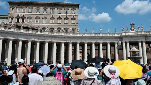 Tourists and pilgrims gather in St. Peter's square during the Angelus prayer, as part of the World ...
