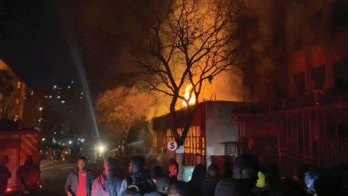 Flames rise from a building amid a deadly fire, in Johannesburg, South Africa, August 31, 2023, in ...