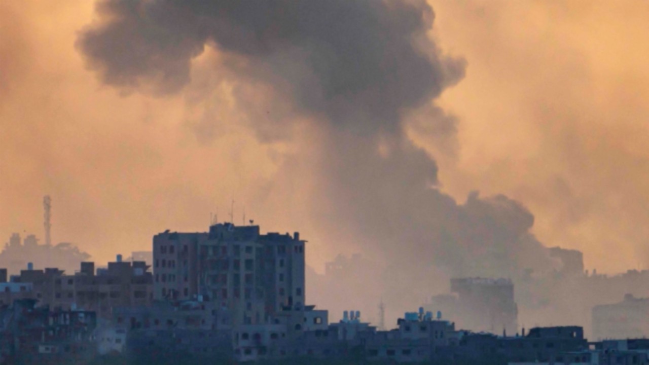 This picture taken from a position in southern Israel near the border with the Gaza Strip shows ...
