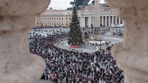 People attend the Angelus prayer led by Pope Francis at the Vatican December 26, 2023.   Vatican ...