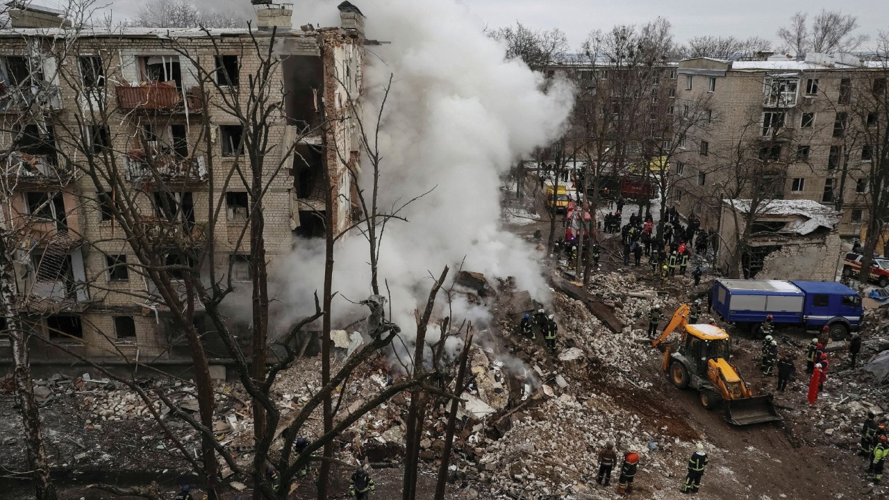 FILE PHOTO: Rescuers work at a site of a residential building heavily damaged during a Russian ...