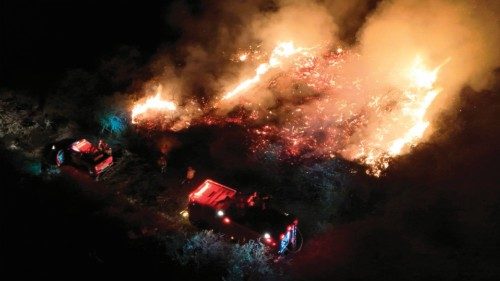 This handout photo released by the Mato Grosso do Sul Fire Department shows firefighters battling to ... This handout photo released by the Mato Grosso do Sul Fire Department shows firefighters battling to ...