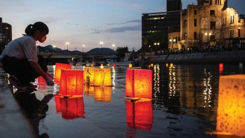 People release paper lanterns on the Motoyasu River beside the Hiroshima Prefectural Industrial ... People release paper lanterns on the Motoyasu River beside the Hiroshima Prefectural Industrial ...