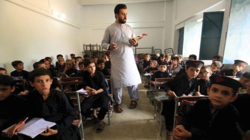 epa11591018 A teacher works with Pakistani school children during a class ahead of the International ... epa11591018 A teacher works with Pakistani school children during a class ahead of the International ...