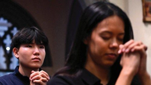 Singaporean Catholics pray during mass at St. Joseph's Church in Singapore on September 10, 2024, ...