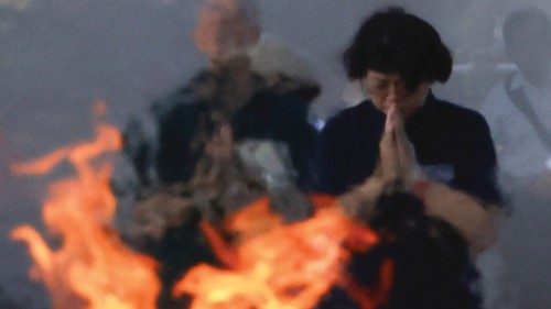 People pray in front of the cenotaph for the victims of the 1945 atomic bombing, at the Peace ... People pray in front of the cenotaph for the victims of the 1945 atomic bombing, at the Peace ...